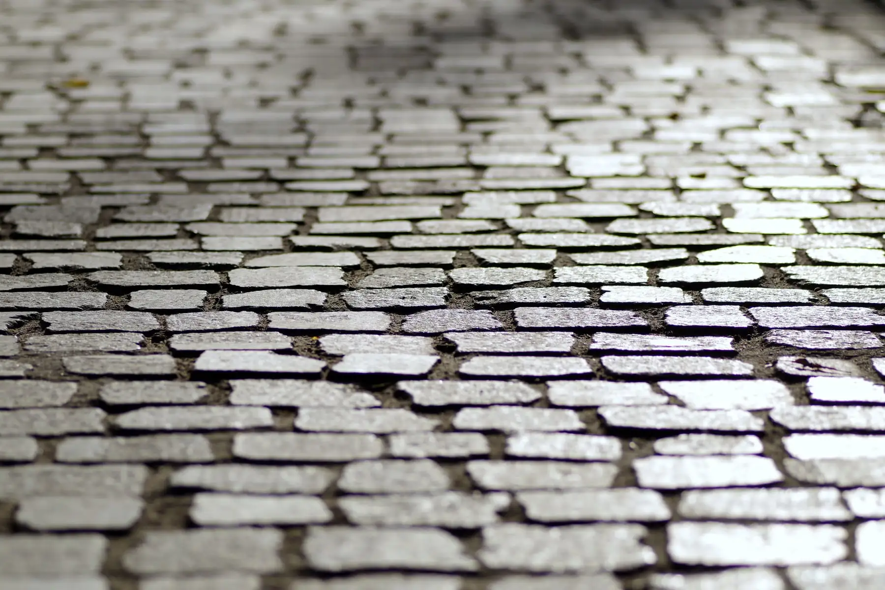 A paved driveway surface on a slope