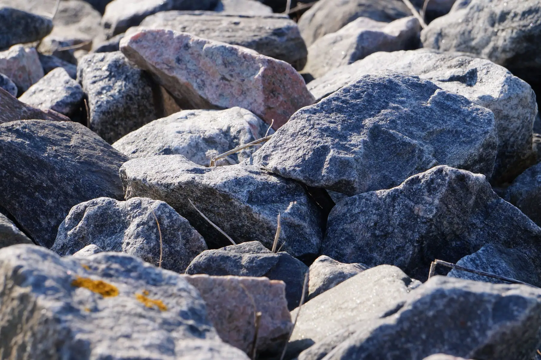 Blue-grey boulders ready for wall placement